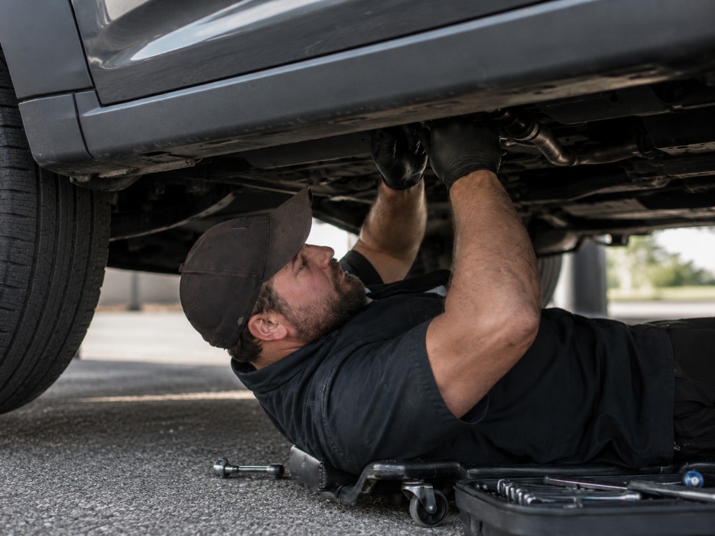 Let's Wrench mobile mechanic working underneath a vehicle on-site in the Mesa, Arizona area